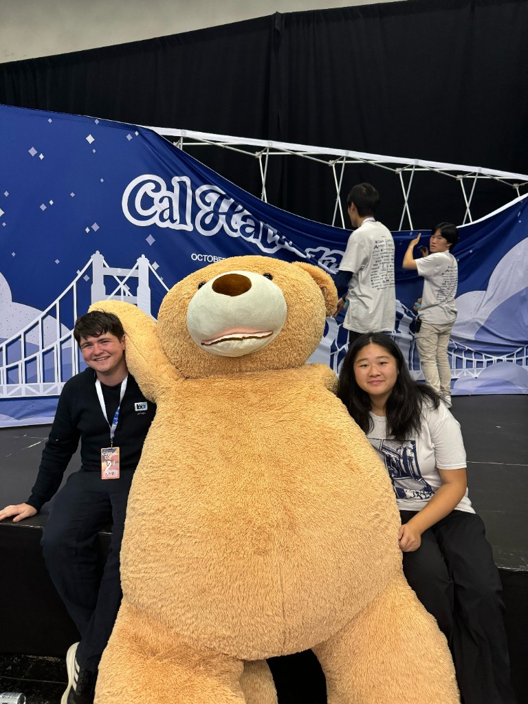 Flora and a teammate with the giant Cal Hacks teddy bear