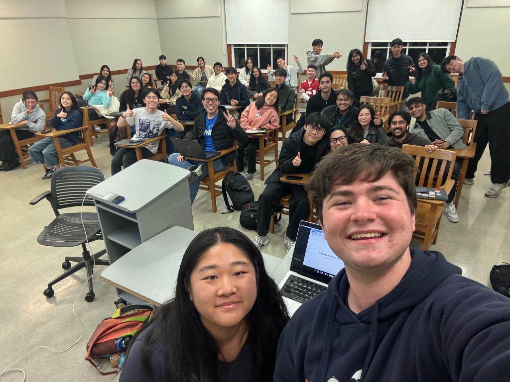 A team selfie during a weekly meeting in a classroom