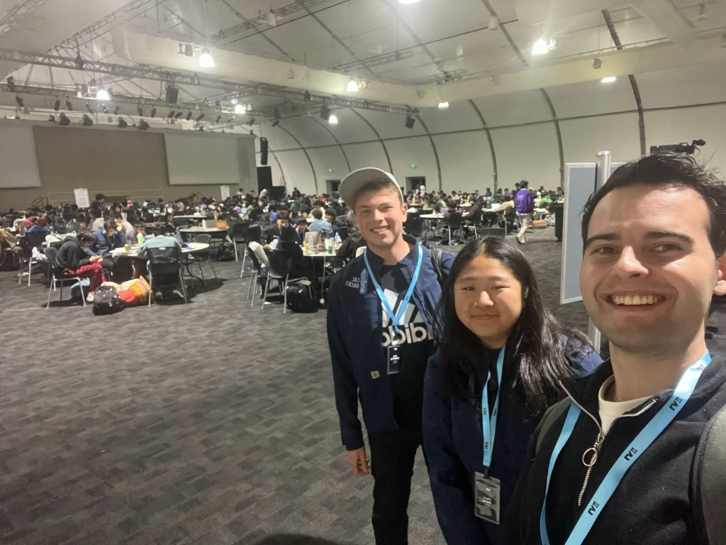 Flora and teammates mentoring at a high school hackathon