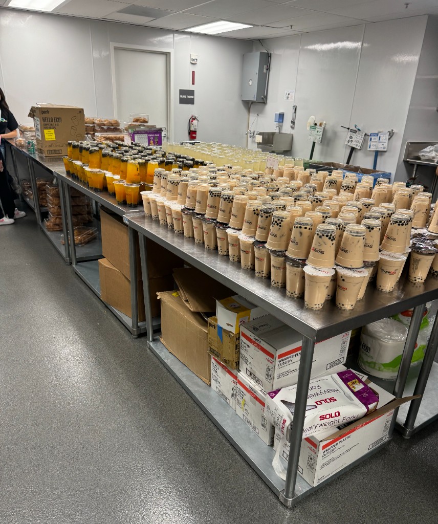 Hundreds of boba and drink cups laid out for Cal Hacks 11.0